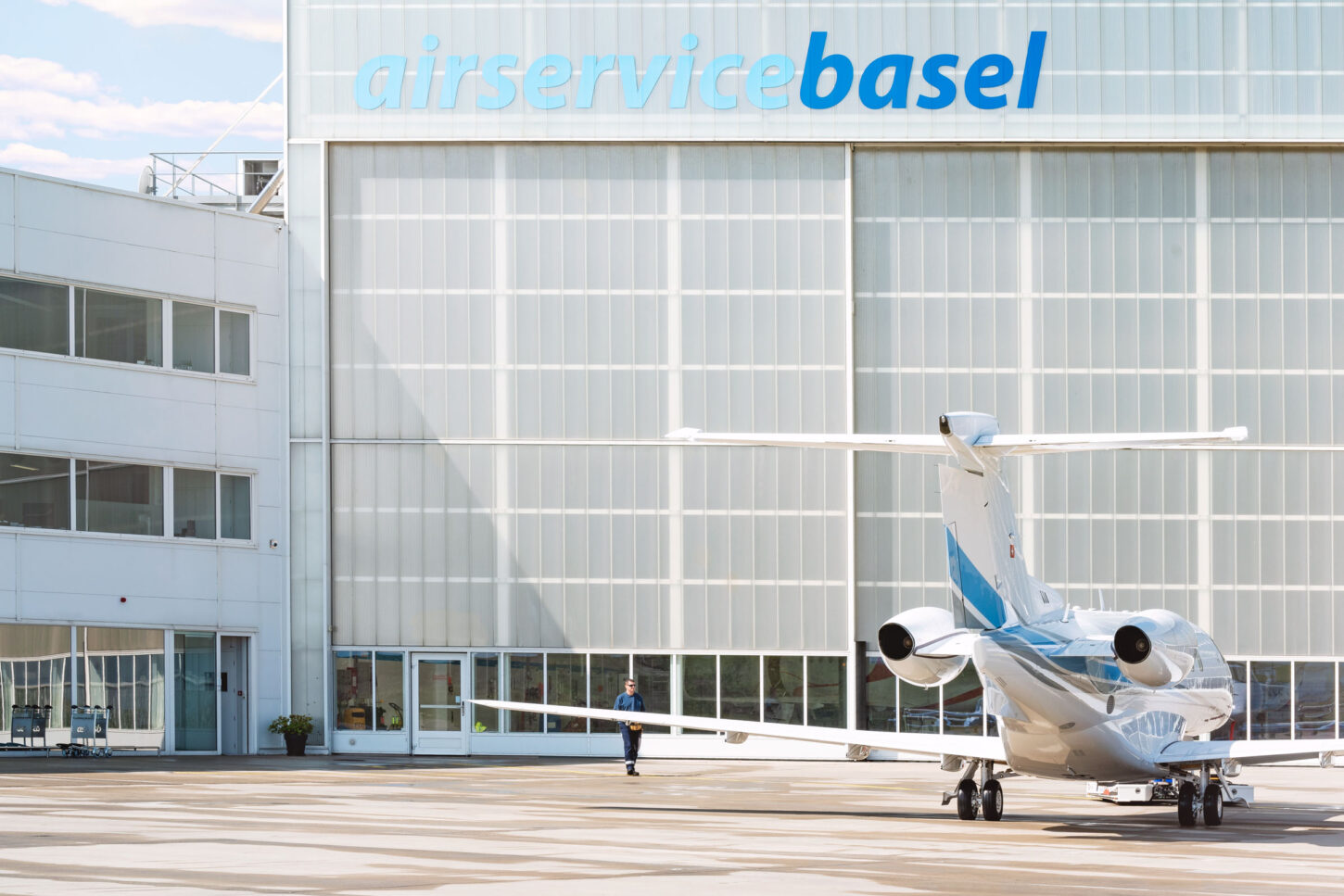 parked aircraft from behind in front of the ASB hangar